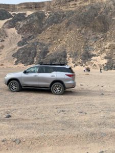 A group of people exploring the desert on a Gazelle Crossover trip.