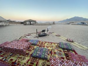 Adventure in the Wilderness Desert Trips with Gazelle Crossover Gazelle Tours A group of people exploring the desert on a Gazelle Crossover trip